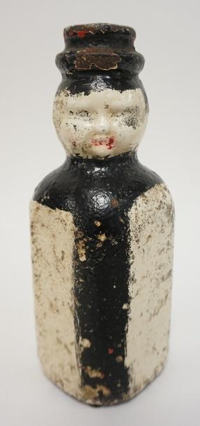 ANTIQUE CAST IRON CARNIVAL MILK BOTTLE (1 of 1)