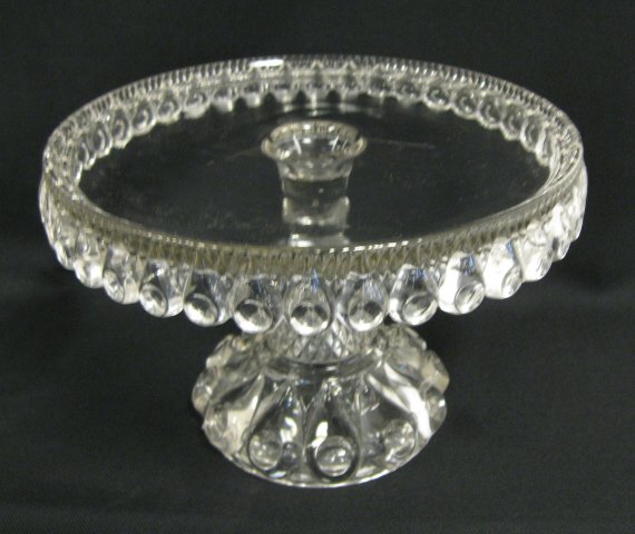 EAPG TORPEDO CAKE STAND; 9 3/4 IN DIA, 6 1/2 IN H