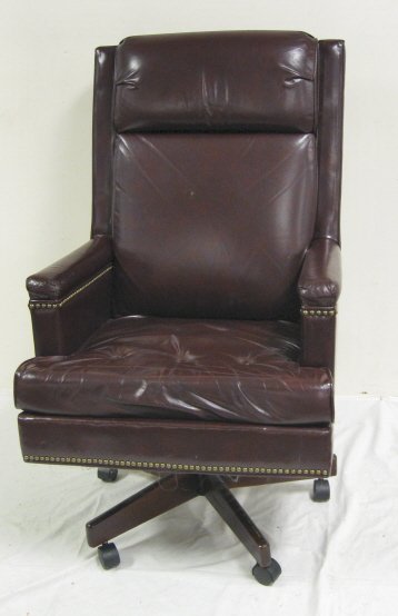 BURGUNDY LEATHER DESK CHAIR; ROCKS & SWIVELS; 48