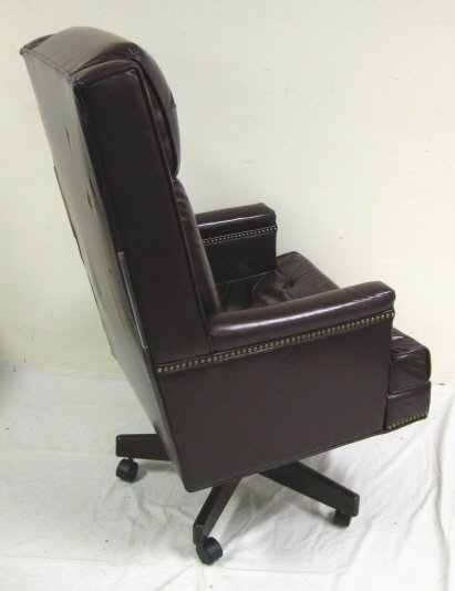 BURGUNDY LEATHER DESK CHAIR; ROCKS & SWIVELS; 48 - 4