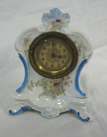 CLOCK; PORCELAIN FLORAL DECORATED CLOCK; 6 1/4 IN