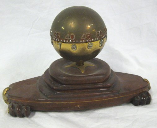 CLOCK; BRASS SPHERICAL DIAL MOUNTED ON A WOODEN B - 2