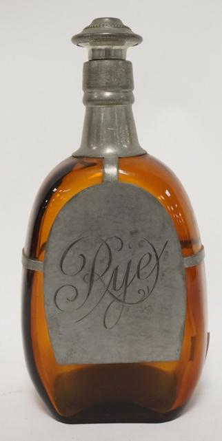 AMBER GLASS RYE BOTTLE W/ PEWTER OVERLAY: AMBER GLASS RYE BOTTLE W/ PEWTER OVERLAY, 9 1/2 IN H