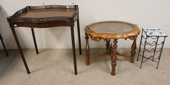 3 PIECES, SMALL TABLES: 3 PIECE LOT- MAHOHANY LAMP TABLE, DAMAGE SPOT TO THE FRETWORK GALLERY, INLAID OVAL GLASS TRAY TOP TABLE MISSING ONE PIECE OF DROP TRIM AND A SMALL TILE TOP STAND WITH WINE HOLDER BASE.