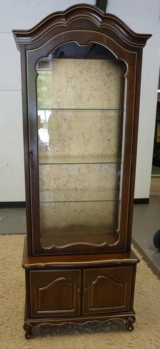 LIGHTED DISPLAY CABINET WITH GLASS SHELVES: LIGHTED DISPLAY CABINET WITH GLASS SHELVES. 2 DOORS BENEATH. 27 1/2 IN WIDE, 75 IN HIGH. SHELVES ADJUSTABLE