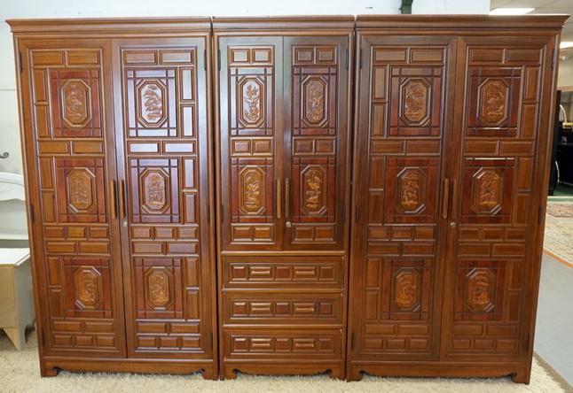 KOREAN 3 SECTION CARVED ARMIORE: KOREAN 3 SECTION CARVED ARMIORE, WITH 6 DOORS AND 3 DRAWERS. IT HAS CARVED PANELS WITH ANIMALS, 110 IN TOTAL WIDTH AND78 1/2 IN HIGH.