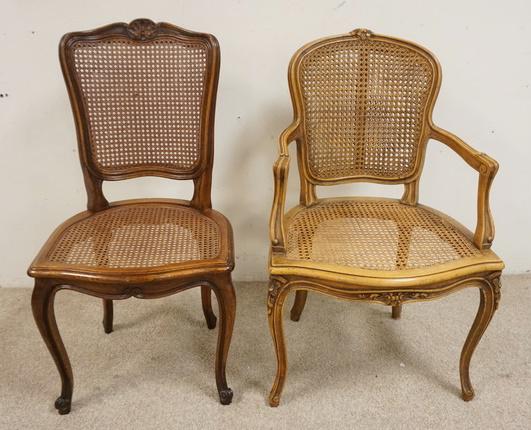 2 CARVED, CANED FRENCH CHAIRS: 2 CARVED FRENCH CHAIRS, ONE ARM, ONE SIDE WITH CANED SEATS & BACKS