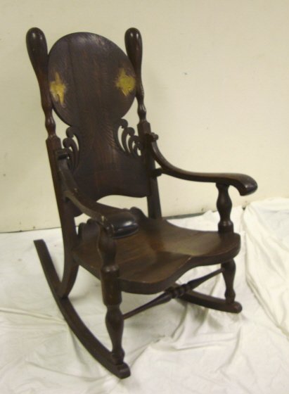 LARGE CARVED OAK ARM ROCKER W/BRASS TRIM; 45 IN H