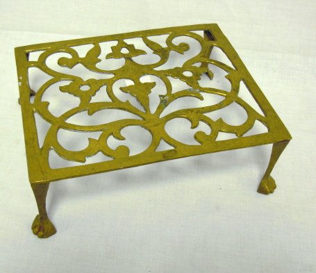 CLAW FOOT BRASS RECTANGULAR TRIVET; 9 1/8 IN X 7