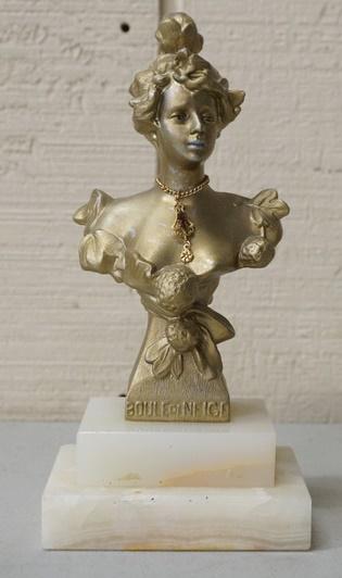 METAL BUST OF A WOMAN ON AN ALABASTER BASE: METAL BUST OF A WOMAN ON AN ALABASTER BASE, *BOULE DE NIGE*, 8 IN HIGH