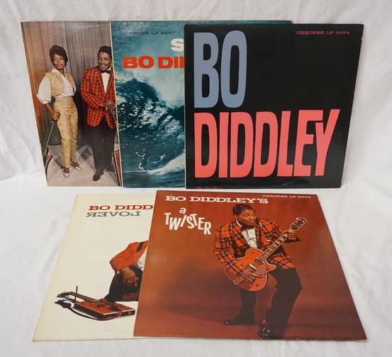 LOT OF 5 BO DIDDLEY ALBUMS ON CHECKER: LOT OF FIVE BO DIDDLEY ALBUMS ON CHECKER RECORD LABEL THREE ARE BLACK LABEL TWO ARE MAROON, BO-DIDDLEY & CO & BO DIDDLEY'S A TWISTER ARE MAROON, SURFIN' WITH BO DIDDLEY, BO DIDDLEY & BO DIDDLEY IS A��