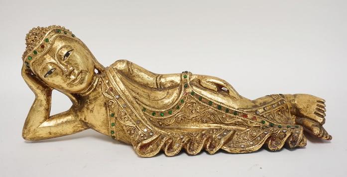 CARVED GILT & JEWELED ASIAN RECLINING FIGURE: CARVED GILT & JEWELED ASIAN RECLINING FIGURE, 16 IN LONG X 6 1/2 IN HIGH