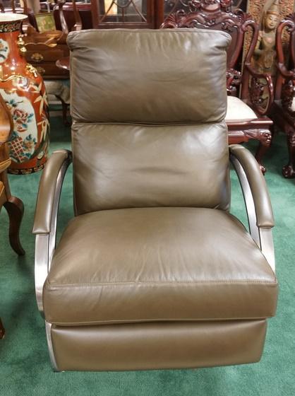 MODERN STEEL AND LEATHER RECLINER: HIGH QUALITY MODERN STEEL AND LEATHER RECLINER. MADE IN USA, 28 3/4 IN HIGH.