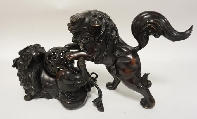 2 BRONZE FOO DOGS AND BALL ORNAMENT: 2 BRONZE FOO DOGS AND A BALL ORNAMENT, SIGNED.