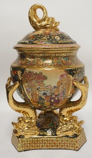 DECORATIVE ASIAN COVERED JAR: DECORATIVE ASIAN JAR WITH DOLPHIN FEET AND FINIAL, 16 IN HIGH.