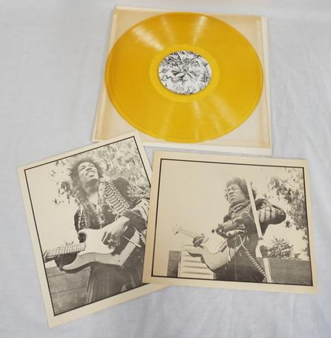 LOT OF 3 BOOTLEG JIMI HENDRIX ALBUMS: LOT OF THREE BOOTLEG JIMI HENDRIX RECORDS ONE OF THE RECORDS HAS SOME DAMAGE (PLEASE SEE PHOTOS) ONE IS YELLOW & COMES WITH TWO PRINTS