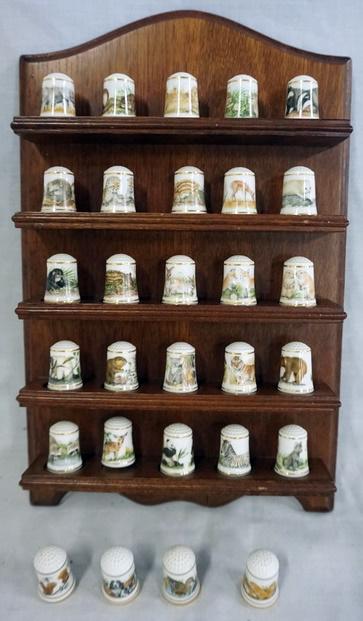 SET OF 25 FRANKLIN MINT BABY ANIMAL THIMBLES: SET OF 25 FRANKLIN MINT BABY ANIMAL THIMBLES. PLUS 4 MOTHER AND BABY THIMBLES, WALL HANGING HOLDER AND PAPERS