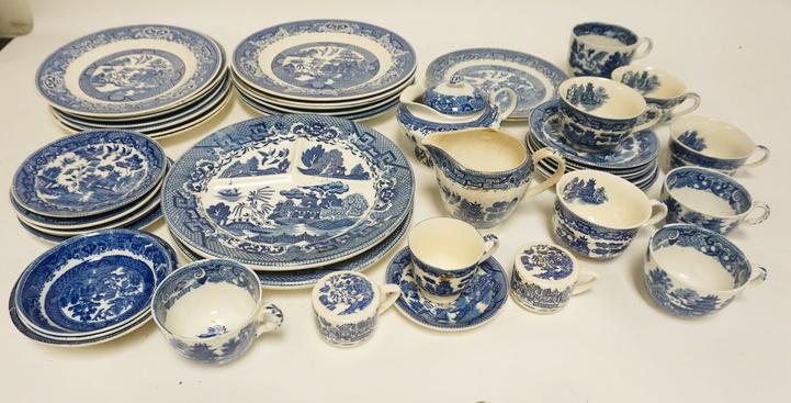 LOT OF BLUE WILLOW DINNERWARE-VARIOUS MAKERS: LOT OF BLUE WILLOW DINNERWARE-VARIOUS MAKERS, LARGEST PLATE IS 10 IN, CHIP ON CREAMER