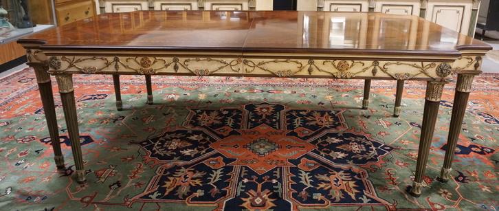 EJ VICTOR NEWPORT HISTORIC COLLECTIONS DINING TABLE: EJ VICTOR NEWPORT HISTORIC COLLECTIONS DINING TABLE, HAS TWO 23 3/4 IN SKIRTED LEAVES, INLAID TOP, PAINTED & CARVED DECORATION, HAS ORIGINAL PADS INCLUDED FOR LEAVES, ORIGINAL LIST PRICE $16,349, 90 I