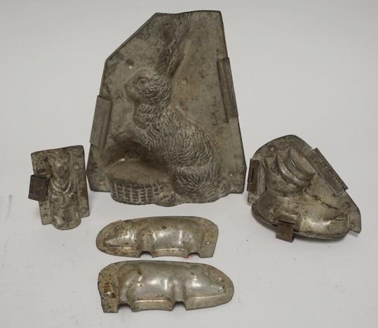 LOT OF 4 CHOCOLATE MOLDS: LOT OF FOUR CHOCOLATE MOLDS; LARGE RABBIT, DUCKLING, A PIG & A SMALL DRESSED PIG LARGEST IS 8 1/4 IN H 7 IN W