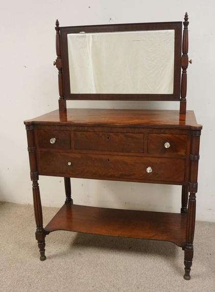 ANTIQUE MAHOGANY DRESSING TABLE W/ MIRROR: ANTIQUE MAHOGANY DRESSING TABLE W/ MIRROR HAS FOUR DRAWERS HAS SOME FINISH WEAR ON THE LEFT SIDE OF THE TOP ONE DRAWER PULL IS MISSING 37 IN W 58 IN H 18 1/2 IN D