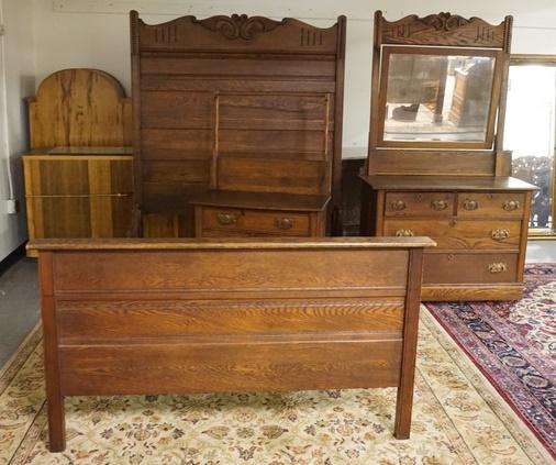 HIGHBACK CARVED OAK 3 PIECE BEDROOM: HIGHBACK CARVED OAK THREE PIECE BEDROOM BED, DRESSER W/ MIRROR & WASHSTAND W/ TOWEL BAR BED IS 56 1/2 IN W 73 IN H. DRESSER IS 74 IN H