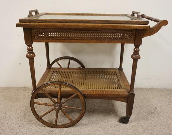 TIGER OAK TEA CART: TIGER OAK TEA CART HAS LIFT OFF GLASS TRAY AND A WHICKER SHELF, 30 IN HANDLES TO FRONT X 17 IN WIDE X 30 3/4 IN TO TOP OF HANDLE