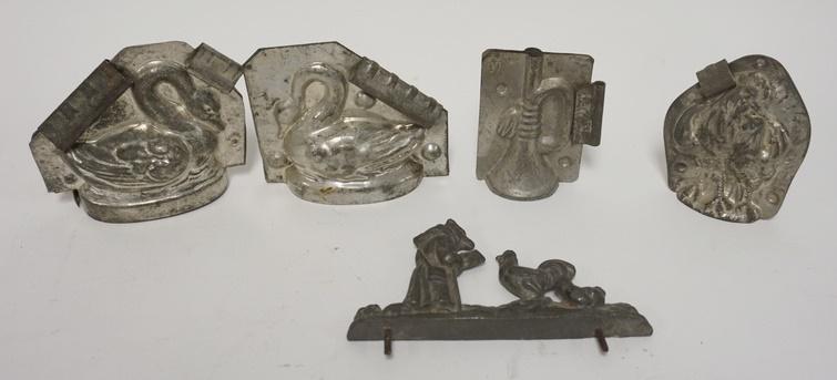 4 1/2 CHOCOLATE MOLDS: FOUR AND A HALF CHOCOLATE MOLDS; TWO SWANS A HORN, ROOSTERS & A HALF MOLD W/ A FOX READING TO CHICKENS SWANS ARE 4 IN X 4 IN
