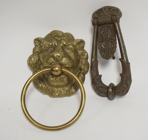 TWO DOOR KNOCKERS; BRASS LION HEAD & CAST IRON W/ DRAPE: TWO DOOR KNOCKERS; BRASS LION HEAD & CAST IRON W/ DRAPE DESIGN LARGEST 9 IN