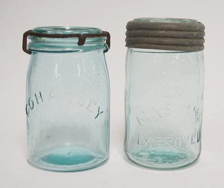 2 CANNING JARS: TWO CANNING JARS; COHANSEY W/ GLASS LID & METAL CLIP & MASON'S IMPROVED W/ IRON CROSS MARK W/ ZINC & GLASS LID. TALLEST IS 6 IN