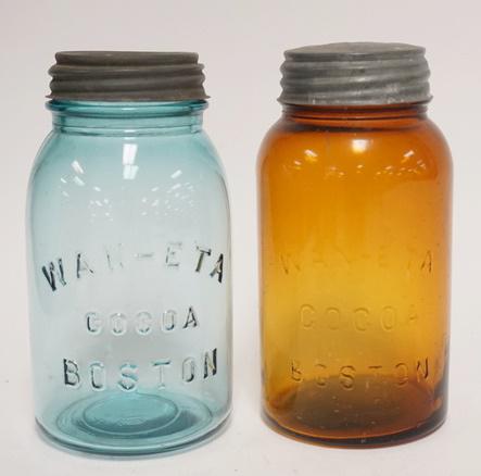 2 WAN-ETA COCOA JARS: TWO WAN-ETA COCOA JARS IN BLUE GREEN & AMBER W/ ZINC LIDS. TALLEST IS 7 1/4 IIN