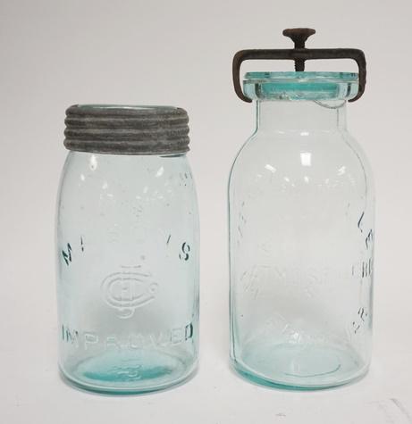 2 CANNING JARS: TWO CANNING JARS; MASONS CJ IMPROVED W/ ZINC & GLASS TOP & THE MILLVILLE ATMOSPHERIC FRUIT JAR W/ GLASS LID & METAL CLAMP. TALLEST IS 9 1/4 IN