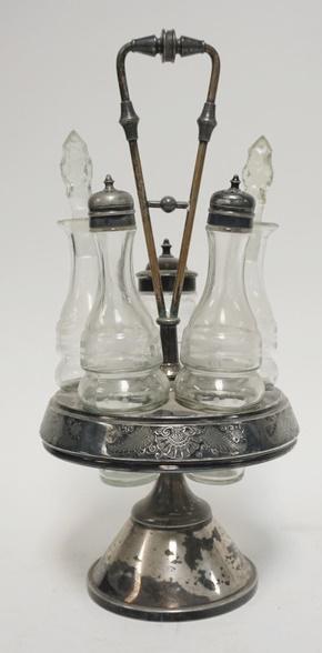 VICTORIAN 5 BOTTLE CASTOR SET: VICTORIAN FIVE BOTTLE CASTOR SET HAS MATCHING ETCHED BOTTLES 15 3/4 IN H