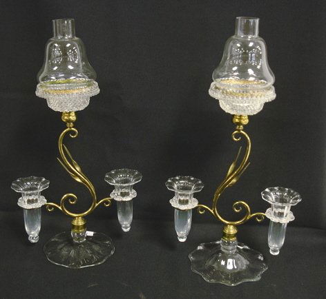 PR OF FAIRY LAMP EPERGNES; BRASS & BLOWN GLASS; I: PR OF FAIRY LAMP EPERGNES; BRASS & BLOWN GLASS; INSERTS ARE SIGNED, *CRICKLITE CLARKES PATENT TRADE MARK*; ONE INSERT IS CRACKED & REGLUED; SHADES ARE SIGNED CRICKLITE ON THE BRASS RIMS; 16 3/4 IN H