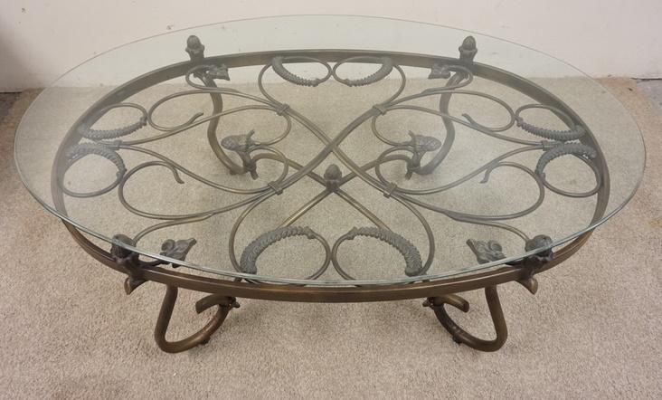 WROUGHT IRON & GLASS OVAL COFFEE TABLE: WROUGHT IRON & GLASS OVAL COFFEE TABLE, 52 IN X 33 IN X 19 IN HIGH