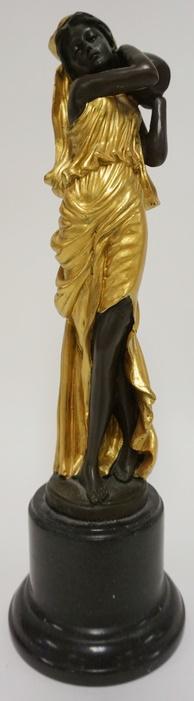 BRONZE STATUE OF A WOMAN WITH GILT BRONZE GARMENTS: BRONZE STATUE OF A WOMAN WITH GILT BRONZE GARMENTS CARRYING A VESSLE ON A MARBLE BASE SGND MILO, 13 1/4 IN HIGH