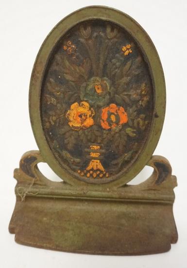 CAST IRON DOORSTOP W/FLOWER BOUQUET: CAST IRON DOORSTOP W/FLOWER BOUQUET, 7 3/4 IN HIGH