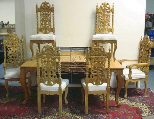 CARVED 7 PC DINING ROOM SUITE: CARVED 7 PC DINING ROOM SUITE; TABLE IS 50 IN X 42 IN W/2 24 IN LEAVES, 6 CHAIRS (2 ARM & 4 SIDE, 31 1/4 IN H) W/LEAF CARVED BACKS