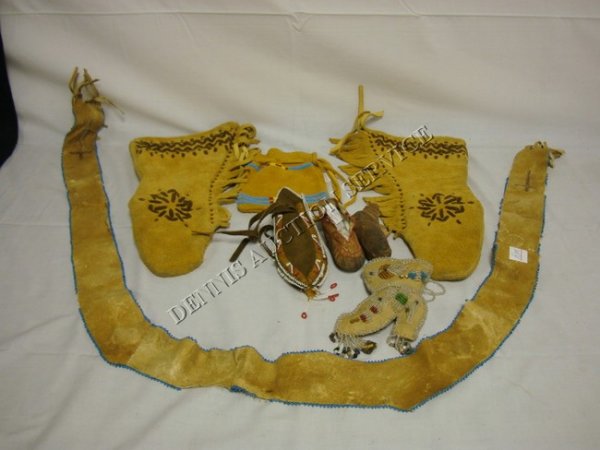 LOT OF INDIAN LEATHER & BEADED ITEMS: LOT OF INDIAN LEATHER & BEADED ITEMS: GLOVES (16 IN L), 2 BEADED POUCHES, PR OF CHILDS MOCCASINS, BEADED BOOT FORM POUCH & SASH W/BEAD TRIM (AS IS, APPROX 65 IN L)