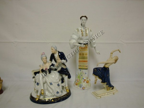 GROUP OF 3 LARGE PORCELAIN FIGURES; ROYAL DUX LAD: GROUP OF 3 LARGE PORCELAIN FIGURES; ROYAL DUX LADY & GENTLEMAN (SHE HAS A FINGER BROKEN OFF, 8 1/2 IN W, 10 1/2 IN H), ROMANIAN WOMAN (16 IN H) & CZECH DANCER (TOP HAND REPAIRED, 9 1/2 IN H)