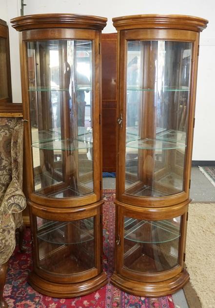 PAIR OF PULASKI CORNER CABINETS: PAIR OF PULASKI CORNER CABINETS HAVE BOW FRONT, MIRROR BACK, GLASS SHELVES & LIGHTING. 22 IN W 68 1/2 IN H