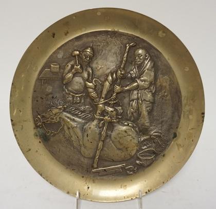 BRASS ASIAN CHARGER: BRASS ASIAN CHARGER, DEPICTING SHOING OF A HORSE, 11 1/ IN