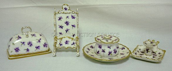 LIMOGES 4 PC PORCELAIN LADY'S DESK SET W/VIOLETS;: LIMOGES 4 PC PORCELAIN LADY'S DESK SET W/VIOLETS; COVERED STAMP HOLDER, INKWELL W/COVER & ATTACHED SPILL, CARD HOLDER & SMALL CANDLESTICK; TALLEST PIECE 4 3/4 IN H