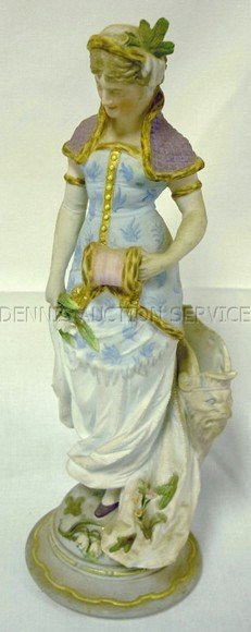 KPM BISQUE FIGURE OF A LADY; SOME CHIPS TO THE AP: KPM BISQUE FIGURE OF A LADY; SOME CHIPS TO THE APPLIED FLOWERS; HAS A POCKET IN THE BACK; 12 1/2 IN H