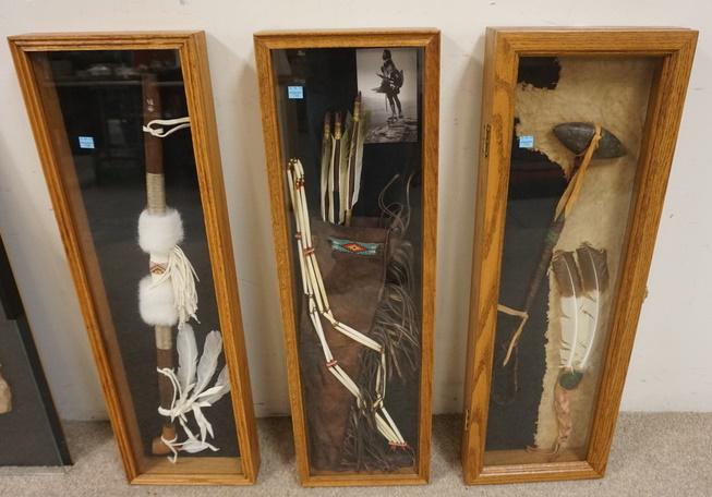 GROUP OF AMERICAN INDIAN ARTIFACTS MOUNTED IN 3 FRAMES: NATIVE AMERICAN ARTIFACTS IN SHADOW BOX FRAMES. INCLUDE QUIVER W/ ARROWS, PEACE PIPE & TAMAHAWK. EACH FRAME IS 11 IN X 33 IN 3 1/8 IN DEEP ONE FRAME HAS A HINGE TOP THE OTHER TWO HAVE GLASS THAT CAN B