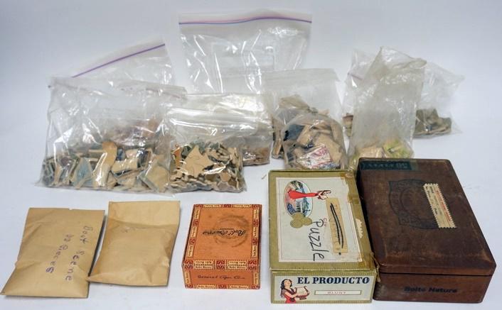 LOT OF MISC. WOOD PUZZLES/PUZZLE PIECES: LOT OF MISC. WOOD PUZZLES/PUZZLE PIECES IN BAGS. THREE ARE IN CIGAR BOXES. NUMBER OF PIECES IS UNCERTIAN