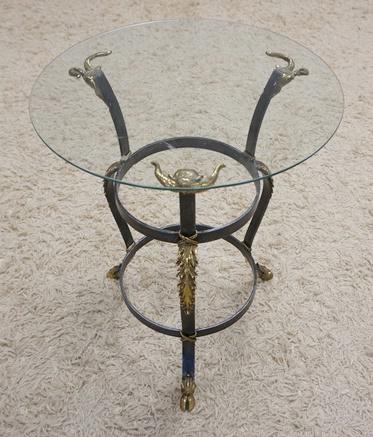 ROUND GLASS TOP TABLE ON METAL BASE: ROUND GLASS TOP TABLE ON METAL BASE W/BRASS RAM HEAD MOUNTS & HOOF FEET