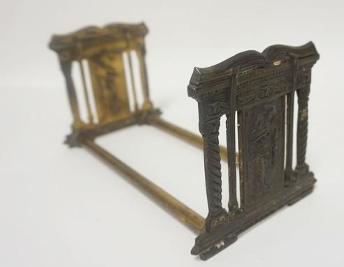 ANTIQUE BRASS SLIDING BOOK HOLDER: ANTIQUE BRASS SLIDING BOOK HOLDER WITH GREEK DESIGN, 8 1/2 IN X 4 1/2 IN X 5 IN DEEP