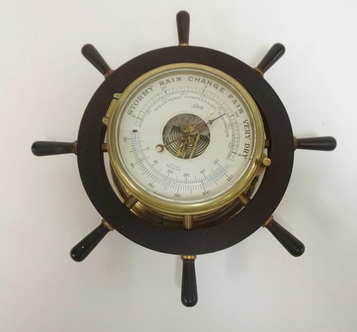SCHATZ SHIPS WHEEL BAROMETER/THERMOMETER: SCHATZ SHIPS WHEEL BAROMETER/THERMOMETER, 13 IN OUTSIDE DIAMETER