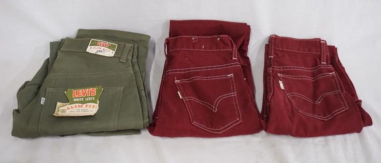 LOT OF 3 PAIRS OF WHITE TAB LEVI JEANS W/ BIG E: LOT OF THREE PAIRS OF LEVI STRAUSS & COMPANY WHITE TAB JEANS W/ BIG E. ONE PAIR STILL HAS ORIGINAL TAGS, VARYING DEGREE OF WEAR, GREEN PANTS ARE W28 X L29